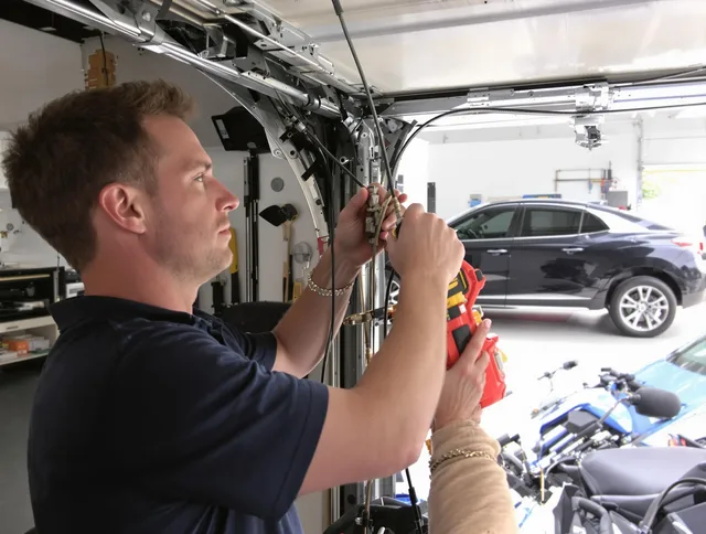 Avon Garage Door Repair safety certified technician performing cable replacement in Avon