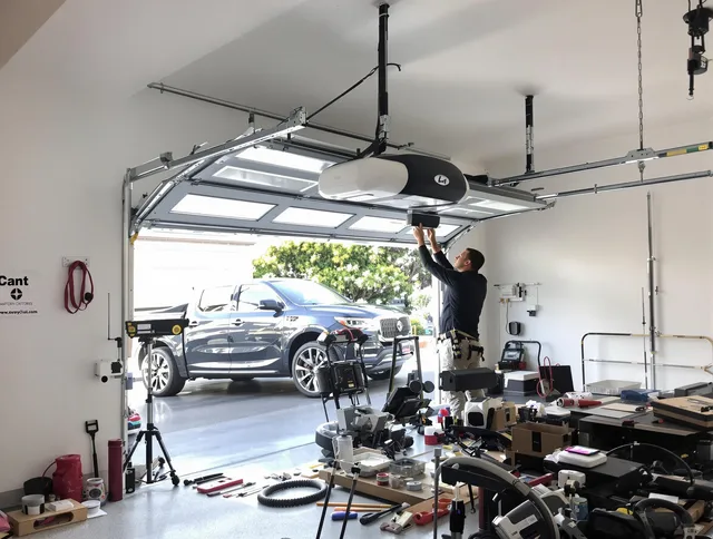 Avon Garage Door Repair specialist installing smart garage door opener system in Avon home