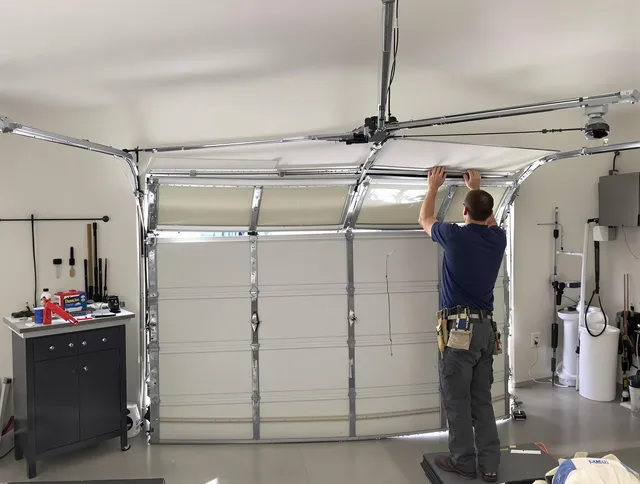 Avon Garage Door Repair specialist performing precise section replacement on Avon garage door