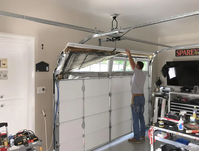 Garage door section replacement by Avon Garage Door Repair in Avon